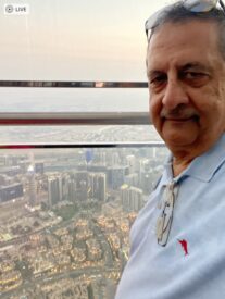 Ray Hanania at the 124th floor of the World's Tallest Building the Burj Khalifa where he got the world's biggest ripoff when they overcharged him for a ticket by more than $240. Tourists beware.